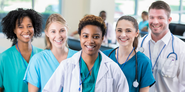 A hospital staff standing and smiling